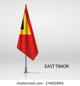 East Timor hanging flag on flagpole