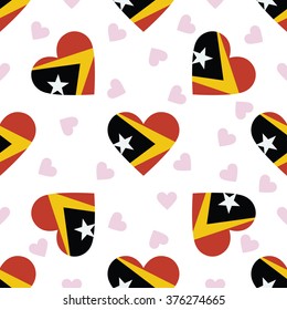East Timor independence day seamless pattern. Patriotic country flag background. East Timor flag in the shape of heart. Vector seamless pattern.