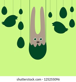 Easter background with brown bunny hanging in eggshell, hanging silhouettes of chicken and egg garlands