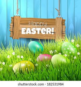 Easter background with colorful eggs in grass and wooden sign