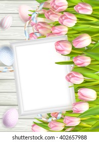 Easter background. Colorful eggs over white wooden background with frame. EPS 10 vector file included