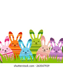 Easter background with Eastern egg shaped bunnies on green grass