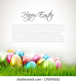 Easter background with eggs in grass and with copyspace