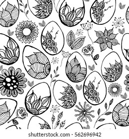 Easter background with eggs hand drawn black on white background. Decorative Easter eggs seamless pattern.