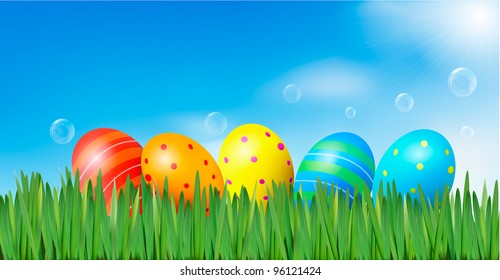 Easter background. Easter eggs laying in green grass under blue sky. Vector.