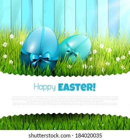 Easter background with green eggs in grass and copyspace