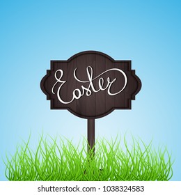 Easter background. Hand lettering, Easter eggs, grass, flowers and wooden sign.