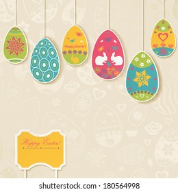 Easter background with hanging on the ropes patterned eggs