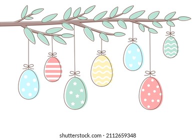 Easter background of spring twig with hanging painted eggs