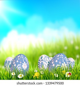 Easter background with traditional Easter eggs in the grass. Place for your text
