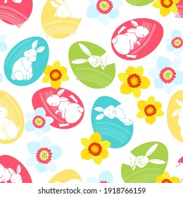 Easter background. Vector. Seamless patternwith colorful Easter eggs , cute rabbits and daffodils on white. Perfect for design templates, wallpaper, wrapping, fabric and textile. 