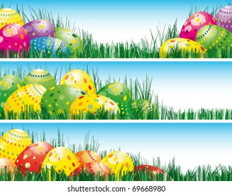 Easter banners with colorful Easter eggs in the young green grass.