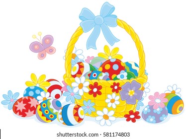 Easter basket with painted eggs and flowers