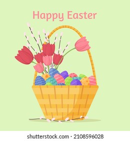 Easter basket with pink tulips, eggs and pussy willow. Happy Easter greating card or background