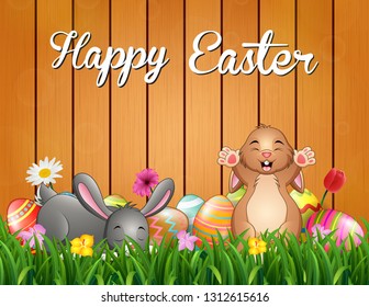 Easter bunnies background with decorated egg on the grass
