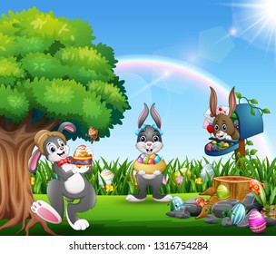 Easter bunnies and colorful egg on the garden