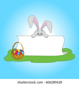 Easter bunnies holding white poster for congratulations on a religious holiday and a straw basket with colored eggs