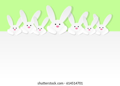 Easter bunnies on green background with copyspace. Vector illustration.