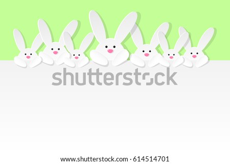 Easter bunnies on green background with copyspace. Vector illustration.