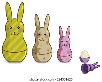 Easter bunnies toys of different sizes and colors with egg