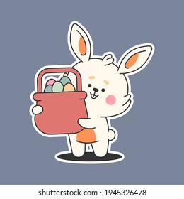 Easter bunny with basket and eggs vector cartoon sticker isolated on background.