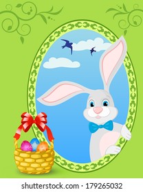 Easter bunny and basket full of colored eggs