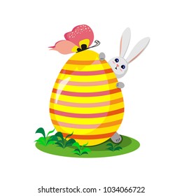 Easter bunny with a big colorful egg on a white background. Vector illustration.