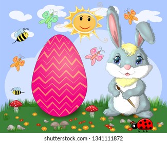 Easter bunny with a brush paints huge Easter egg on glade, the sun, butterflies, spring. Copy space