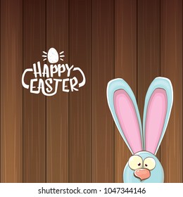 easter bunny with calligraphic text happy easter isolated on wooned background. vector easter greeting card with blue rabbits ears