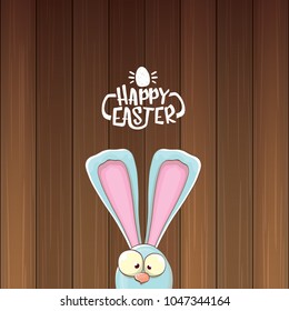easter bunny with calligraphic text happy easter isolated on wooned background. vector easter greeting card with blue rabbits ears
