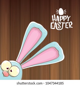 easter bunny with calligraphic text happy easter isolated on wooned background. vector easter greeting card with blue rabbits ears