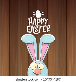 easter bunny with calligraphic text happy easter isolated on wooned background. vector easter greeting card with blue rabbits ears