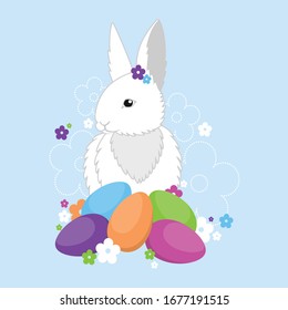 Easter bunny with colorful eggs and flowers