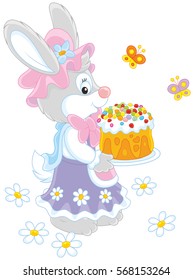 Easter Bunny with a colorfully decorated holiday cake