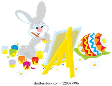 Easter Bunny drawing a colorful egg