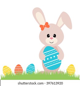 easter bunny with egg on the grass