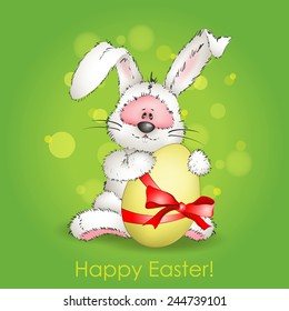 Easter Bunny with Easter egg on green background