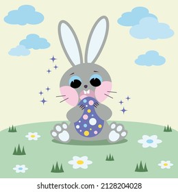 Easter bunny with egg. A postcard for the Easter holiday. A rabbit is sitting in a clearing.
