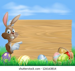 Easter bunny with Easter Eggs and blank wooden sign for your text