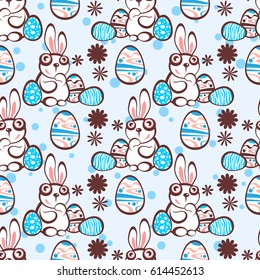 Easter bunny and eggs on blue background. Seamless pattern for wrapping paper or textile print.