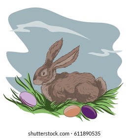 Easter bunny and Easter eggs on green grass