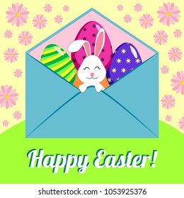 Easter bunny in an envelope with eggs on a background with flowers