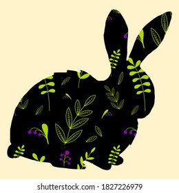 Easter bunny with floral pattern. A silhouette of a hare on a light background. Leaves and berries on a black background