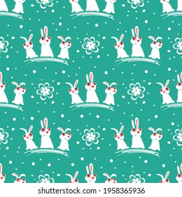 Easter bunny and flowers on blue background. Seamless pattern for wrapping paper or textile print.