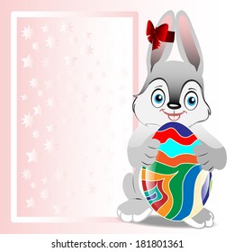 Easter bunny holding Easter egg on a background frame for congratulations