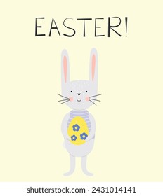 The Easter bunny holds a painted egg in his paws. Happy easter. Horizontal poster, Easter greeting card, Happy Easter banner.