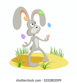 Easter bunny juggles on the lawn with several multi-colored Easter eggs on a white background