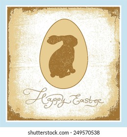 Easter bunny on a background of an egg on the shabby paper