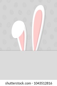 Easter bunny on background with eggs. Layout of a card. Vector.