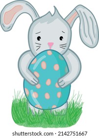 Easter Bunny on the grass. Bunny hold an Easter egg in his hands.